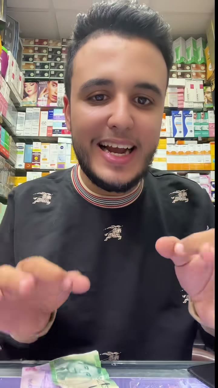 Frame from a TikTok video: The salesperson shows two tubes of Eva Natural Glow Facial Wash for two different skin types